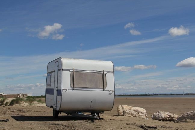 Tiny house on wheels parked in nature, illustrating mobile small home lifestyle and freedom of travel