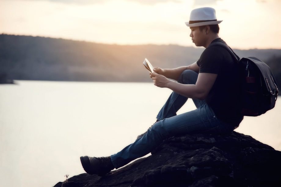 Mindful Moments A Notification-Free Day in Silverton Solo traveler journaling by the mountainside, embracing a digital detox