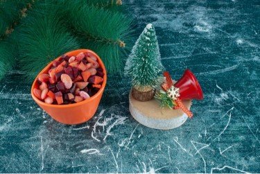 Seasonal Favourites Holiday & Christmas Dog Treats (1) (1) A festive tray of star-shaped pumpkin treats with yoghurt frosting next to a Christmas tree. Alt Text: Dog treats of holiday pumpkin and cinnamon dog goodies, dog-safe frosting that are ready to be given as a present at Christmas time.