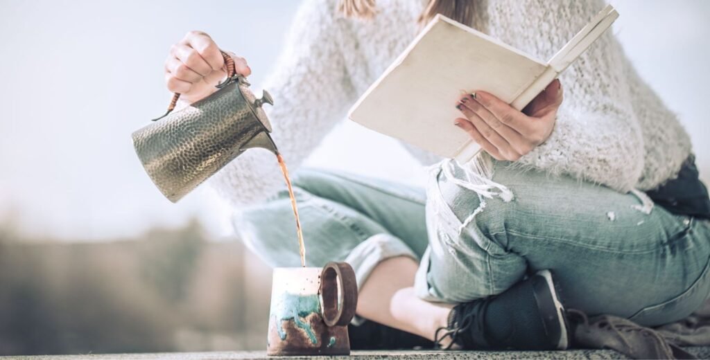 The 10 Minute Workout That Changed Her Life Mindful tea practice with a warm cup of tea with an open journal and some morning rays