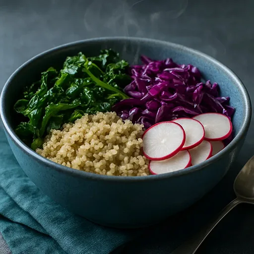 Colorful silent meal in a blue bowl with steam, bright greens and purples on a slate table in cool daylight