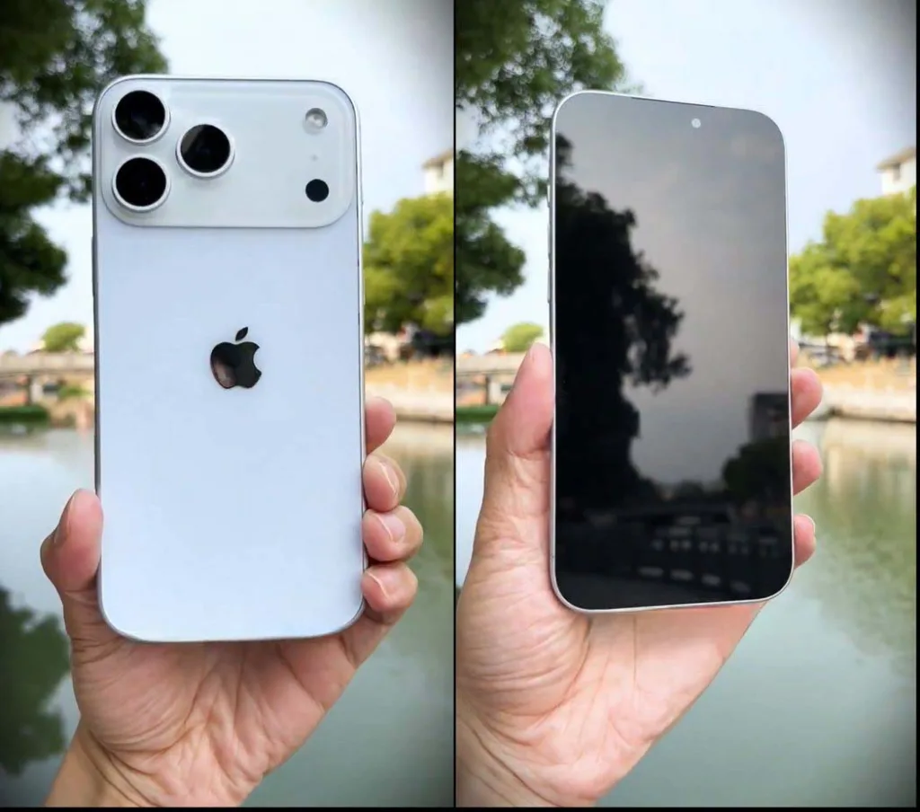 Apple iPhone 17 Pro Max in silver finish held outdoors, showing triple-lens camera bump and sleek matte design during first impressions.